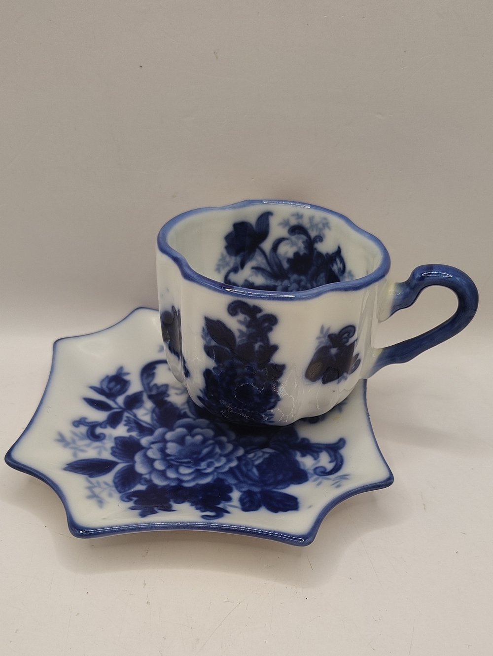 Blue and White Floral Porcelain Teacup with Matching Saucer